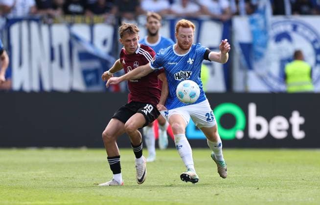25 08 2024, xdcx, Soccer 2 Bundesliga, SV Darmstadt 98 1 FC Nürnberg, emonline, emspor, despor, v l , Michal Sevcik 1 FC Nürnberg , Paul Will SV Darmstadt 98 DFL DFB REGULATIONS PROHIBIT ANY USE OF PHOTOGRAPHS AS IMAGE SEQUENCES AND OR QUASI VIDEO Copyright: HMBxMedia Claus