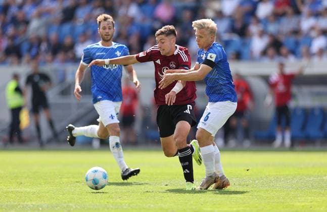 25 08 2024, xdcx, Soccer 2 Bundesliga, SV Darmstadt 98 1 FC Nürnberg, emonline, emspor, despor, v l , Stefanos Tzimas 1 FC Nürnberg , Andreas Müller SV Darmstadt 98 DFL DFB REGULATIONS PROHIBIT ANY USE OF PHOTOGRAPHS AS IMAGE SEQUENCES AND OR QUASI VIDEO Copyright: HMBxMedia Claus