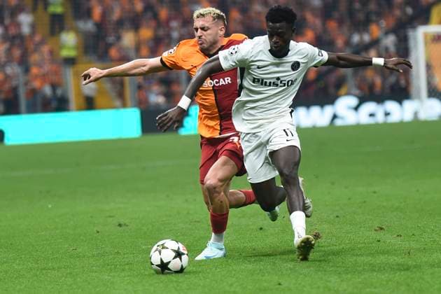 Baris Alper Yilmaz of Galatasaray and Ebrima Colley (11) of Young Boys during the UEFA Champions League Play-Offs Second Leg match between Galatasaray and Young Boys at Rams Park Stadium in Istanbul , Turkey on August 27 , 2024. ( Photo by Seskimphoto ) Galatasaray v Young Boys - UEFA Champions League Play-Offs Second Leg 