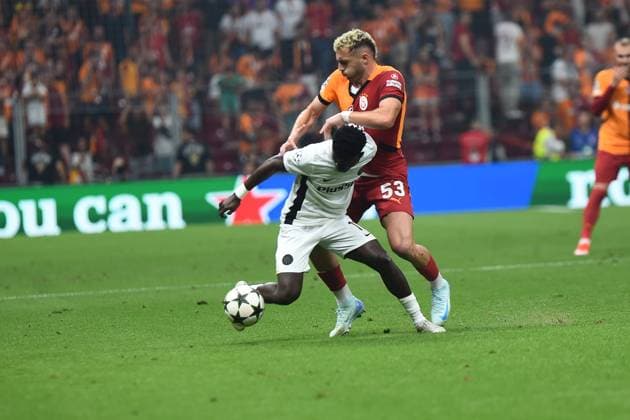 Baris Alper Yilmaz of Galatasaray and Ebrima Colley (11) of Young Boys during the UEFA Champions League Play-Offs Second Leg match between Galatasaray and Young Boys at Rams Park Stadium in Istanbul , Turkey on August 27 , 2024. ( Photo by Seskimphoto ) Galatasaray v Young Boys - UEFA Champions League Play-Offs Second Leg 