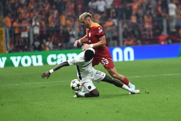 Baris Alper Yilmaz of Galatasaray and Ebrima Colley (11) of Young Boys during the UEFA Champions League Play-Offs Second Leg match between Galatasaray and Young Boys at Rams Park Stadium in Istanbul , Turkey on August 27 , 2024. ( Photo by Seskimphoto ) Galatasaray v Young Boys - UEFA Champions League Play-Offs Second Leg 