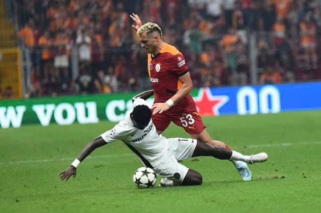 Baris Alper Yilmaz of Galatasaray and Ebrima Colley (11) of Young Boys during the UEFA Champions League Play-Offs Second Leg match between Galatasaray and Young Boys at Rams Park Stadium in Istanbul , Turkey on August 27 , 2024. ( Photo by Seskimphoto ) Galatasaray v Young Boys - UEFA Champions League Play-Offs Second Leg 