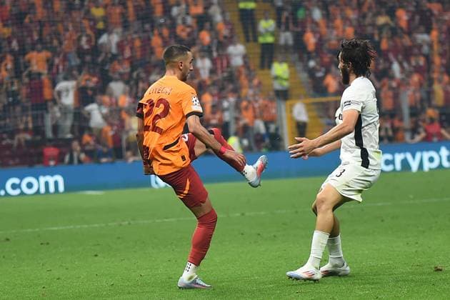 Hakim Ziyech (L) of Galatasaray and Jaouen Hadjam of Young Boys during the UEFA Champions League Play-Offs Second Leg match between Galatasaray and Young Boys at Rams Park Stadium in Istanbul , Turkey on August 27 , 2024. ( Photo by Seskimphoto ) Galatasaray v Young Boys - UEFA Champions League Play-Offs Second Leg 