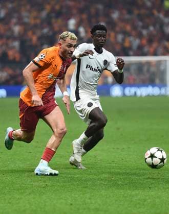 Baris Alper Yilmaz of Galatasaray and Ebrima Colley (11) of Young Boys during the UEFA Champions League Play-Offs Second Leg match between Galatasaray and Young Boys at Rams Park Stadium in Istanbul , Turkey on August 27 , 2024. ( Photo by Seskimphoto ) Galatasaray v Young Boys - UEFA Champions League Play-Offs Second Leg 