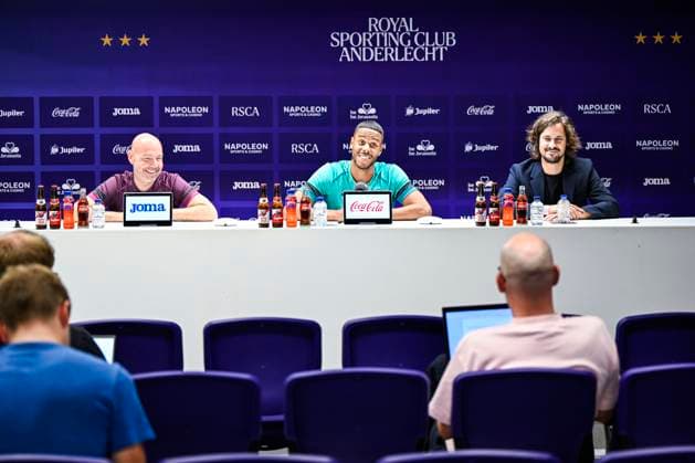 Anderlecht s head coach Brian Riemer, Anderlecht s Mathias Jattah-Njie Jorgensen Zanka and Anderlecht s spokesman Mathias Declercq pictured during a press conference, PK, Pressekonferenz of Belgian soccer team RSC Anderlecht, on Wednesday 28 August 2024 in Brussels. The team is preparing for tomorrow s game against Belarusian FC Dinamo Minsk, the return leg of the play-offs for the UEFA Europa League competition. Anderlecht won the first leg 0-1. TOM GOYVAERTS TomxGoyvaerts  x99248968x