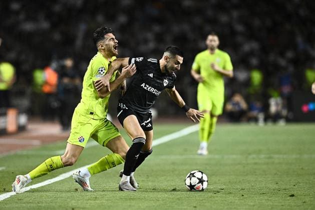Qarabag v GNK Dinamo Zagreb - UEFA Champions Qualifying Play-Off: Second Leg BAKU, AZERBAIJAN - AUGUST 28: Sandro Kulenovic of Dinamo Zagreb and Yassine Benzia of Qarabag in action during the UEFA Champions Qualifying Play-Off Second Leg match between Qarabag and GNK Dinamo Zagreb at Tofiq Bahramov Stadium on August 28, 2024 in Baku, Azerbaijan.  MarkoxLukunic PIXSELL