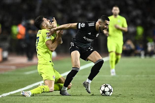 Qarabag v GNK Dinamo Zagreb - UEFA Champions Qualifying Play-Off: Second Leg BAKU, AZERBAIJAN - AUGUST 28: Sandro Kulenovic of Dinamo Zagreb and Yassine Benzia of Qarabag in action during the UEFA Champions Qualifying Play-Off Second Leg match between Qarabag and GNK Dinamo Zagreb at Tofiq Bahramov Stadium on August 28, 2024 in Baku, Azerbaijan.  MarkoxLukunic PIXSELL