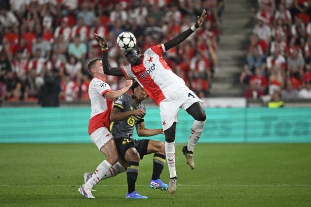 L-R David Zima (Slavia), Tiago Santos (Lille) and El Hadji Malick Diouf (Slavia) in action during the UEFA Champions League, 4th qualifying round, return match SK Slavia Praha (Czechia) vs Lille OSC (France), in Prague, Czech Republic, on August 28, 2024. (CTKxPhoto MichalxKamaryt) CTKPhotoP2024082808296  CTKPhotoP2024082808296