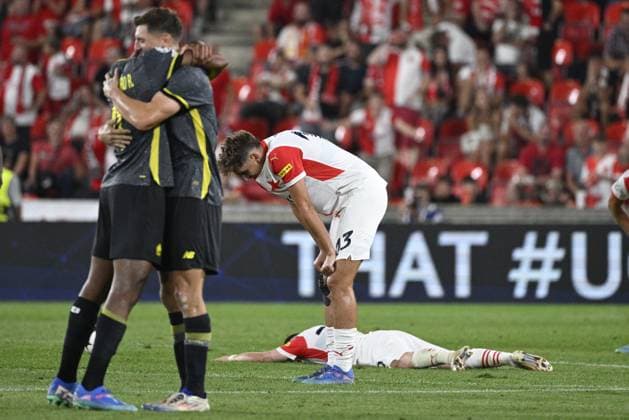 Mojmir Chytil (Slavia; middle) and Christos Zafeiris (Slavia; right) are seen after the UEFA Champions League, 4th qualifying round, return match SK Slavia Praha (Czechia) vs Lille OSC (France), in Prague, Czech Republic, on August 28, 2024. Slavia won 2:1, but could not erase the 0:2 loss from the opening match. On the left, Lille players celebrate progressing to the main stage of the Champions League. (CTKxPhoto MichalxKamaryt) CTKPhotoP2024082808806  CTKPhotoP2024082808806