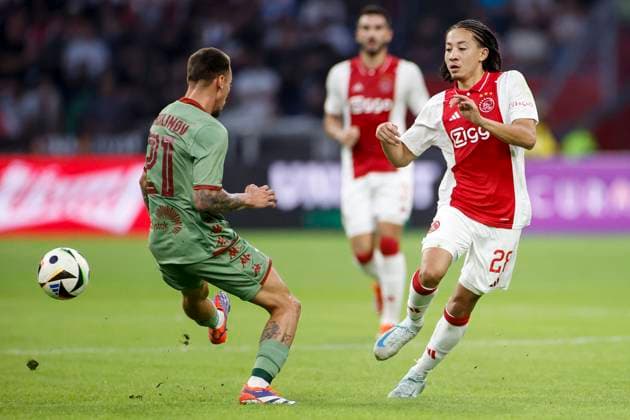 AMSTERDAM, 29-08-2024 , JohanCruyff Arena, Europa League Play Offs, season 2024 2025, Ajax- Jagiellonia Bialystok. (L-R) Jagiellonia Bialystok player Darko Churlinov, Ajax player Brian Brobbey Ajax - Jagiellonia Bialystok  x26143749x Copyright: