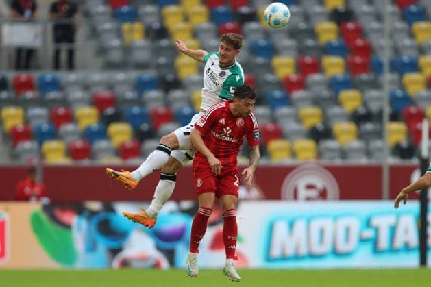 Phil Neumann Hannover 96 and Dawid Kownacki Fortuna Duesseldorf in a duel during the 2 Bundesliga match between Fortuna Düsseldorf and Hannover 96 at Merkur Spiel Arena on August 30, 2024 in Düsseldorf, Germany Photo by Oliver Kaelke DeFodi Images Phil Neumann Hannover 96 and Dawid Kownacki Fortuna Duesseldorf battle for the ball during the 2 Bundesliga match between Fortuna Düsseldorf and Hannover 96 at Merkur Spiel Arena on August 30, 2024 in Düsseldorf, Germany Photo by Oliver Kaelke DeFodi Images DFB DFL REGULATIONS PROHIBIT ANY USE OF PHOTOGRAPHS AS IMAGE SEQUENCES AND OR QUASI VIDEO Photo by Oliver Kaelke DeFodi Images Defodi 678 2024 08 30 OK DUSH96 0682 Defodi-678 DFB DFL REGULATIONS PROHIBIT ANY USE OF PHOTOGRAPHS AS IMAGE SEQUENCES AND OR QUASI-VIDEO.