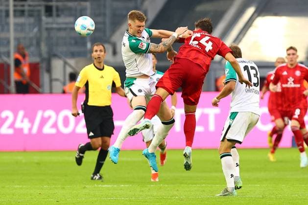 Josh Knight Hannover 96 in duel, action, with Dawid Kownack Fortuna Duesseldorf vs Hannover 96, Soccer, 2 Bundesliga, 4 Matchday, Season 2024 2025, 30 08 2024 DFL REGULATIONS PROHIBIT ANY USE OF PHOTOGRAPHS AS IMAGE SEQUENCES AND OR QUASI VIDEO Photo kolbert press Ant Palmer Merkur Spiel Arene NRW Germany Copyright: xkolbert-press AntxPalmerx