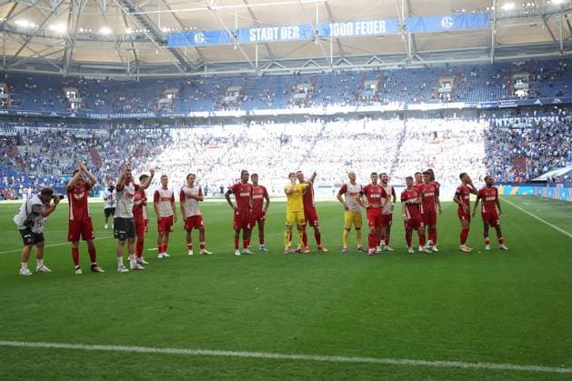 The players of 1 FC Köln together with the fans are happy about the 1 3 victory in the match of the 2 BL season 2024 25 FC Schalke 04 1 FC Köln Copyright Thomas Pakusch