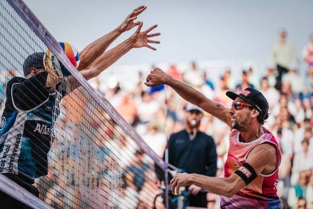 Beach volleyball men Allianz German Beach Tour German Beach Volleyball Championship 2024 01 09 2024 Nejc Zemljak on the right attacking Robin Sowa on the left Timmendorfer Strand Ahmann Hager Arena Schleswig Holstein Germany