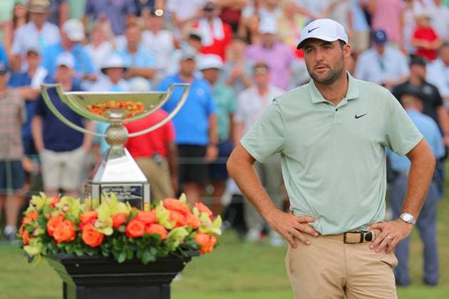 ATLANTA, GA - SEPTEMBER 01: Scottie Scheffler (USA) checks out the trophy after winning the FedExCup TOUR Championship on September 1, 2024 at East Lake Golf Club in Atlanta, Georgia. (Photo by David J. Griffin Icon Sportswire) GOLF: SEP 01 PGA, Golf Herren FedExCup Playoffs - TOUR ChampionshipÃŠ EDITORIAL USE ONLY Icon9532409011310