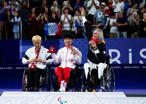 PARIS, FRANCE SEPTEMBER 02 Thomas WANDSCHNEIDER GER , startclass WH1 wins the bronze medal and celebrates during the winning ceremony Paris 2024 Summer Paralympic Games at Porte de la Chapelle Arena on September 02, 2024 in Paris, France Photo by Mika Volkmann DBS 202408027-20240908