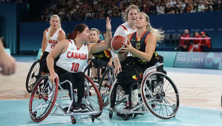Paris , Paralympics , Wheelchair basketball quarter-final Germany vs Canada , from left Puisand Lai CAN Svenja Mayer GER