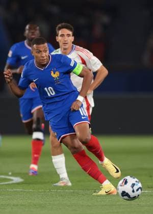 Paris, France, 6th September 2024. Kylian Mbappe of France passes the ball as Andrea Cambiaso of Italy looks on during the UEFA Nations League match at Le Parc des Princes, Paris. Picture credit should read: Jonathan Moscrop Sportimage EDITORIAL USE ONLY. No use with unauthorised audio, video, data, fixture lists, club league logos or live services. Online in-match use limited to 120 images, no video emulation. No use in betting, games or single club league player publications. SPI-3291-0009