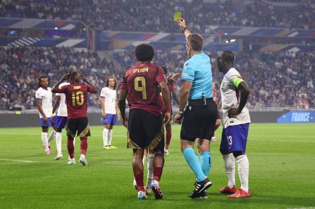 France v Belgium - UEFA Nations League LYON, FRANCE - SEPTEMBER 09 : referee Stieler Tobias (GER) shows a yellow card to Doku Jeremy forward of Belgium during the UEFA Nations League match in group A2 between France and Belgium on September 9, 2024 in Lyon, France, 09 09 2024 Lyon France  Copyright: xTomasxSiskx