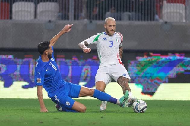 Budapest, Hungary, 9th September 2024. Sagiv Jehezkel of Israel challenges Federico Dimarco of Italy during the UEFA Nations League match at Bozsik Arena, Budapest. Picture credit should read: Jonathan Moscrop Sportimage EDITORIAL USE ONLY. No use with unauthorised audio, video, data, fixture lists, club league logos or live services. Online in-match use limited to 120 images, no video emulation. No use in betting, games or single club league player publications. SPI-3292-0074