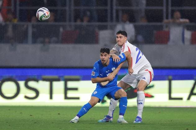 Budapest, Hungary, 9th September 2024. Alessandro Bastoni of Italy battles for possession with Manor Solomon of Israel as they focus on the ball during the UEFA Nations League match at Bozsik Arena, Budapest. Picture credit should read: Jonathan Moscrop Sportimage EDITORIAL USE ONLY. No use with unauthorised audio, video, data, fixture lists, club league logos or live services. Online in-match use limited to 120 images, no video emulation. No use in betting, games or single club league player publications. SPI-3292-0080