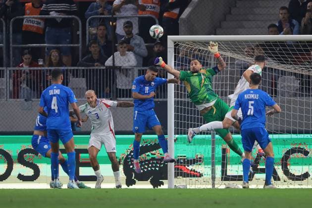 Budapest, Hungary, 9th September 2024. Gianluigi Donnarumma of Italy punches the ball clear from Sagiv Jehezkel of Israel during the UEFA Nations League match at Bozsik Arena, Budapest. Picture credit should read: Jonathan Moscrop Sportimage EDITORIAL USE ONLY. No use with unauthorised audio, video, data, fixture lists, club league logos or live services. Online in-match use limited to 120 images, no video emulation. No use in betting, games or single club league player publications. SPI-3292-0094