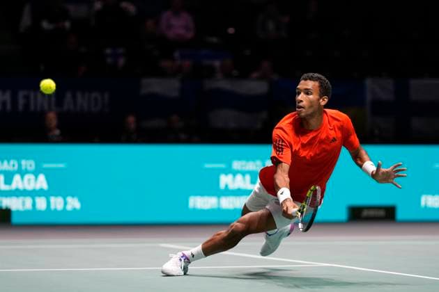 12th September 2024; AO Arena, Manchester, England; Davis Cup Finals, Group Stage, Group D Day 3; Felix Auger-Aliassime of Canada plays a diving backhand during the first set of the second rubber  ActionPlus12691623 StevenxFlynn