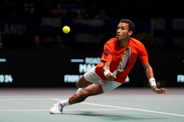12th September 2024; AO Arena, Manchester, England; Davis Cup Finals, Group Stage, Group D Day 3; Felix Auger-Aliassime of Canada plays a diving backhand during the first set of the second rubber  ActionPlus12691624 StevenxFlynn