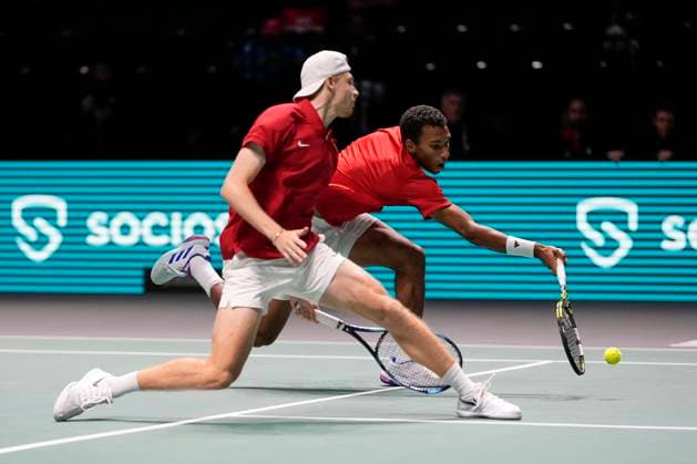 12th September 2024; AO Arena, Manchester, England; Davis Cup Finals, Group Stage, Group D Day 3; Felix Auger-Aliassime of Canada stretches for a forehand during his doubles match against Finland  ActionPlus12691646 StevenxFlynn