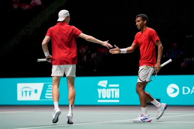 12th September 2024; AO Arena, Manchester, England; Davis Cup Finals, Group Stage, Group D Day 3; Denis Shapovalov of Canada celebrates with Felix Auger-Aliassime of Canada after winning a game in the doubles match  ActionPlus12691648 StevenxFlynn