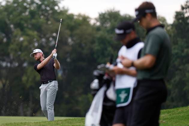 FRANKLIN, TN - SEPTEMBER 12: Danny Walker hits a shot in the No. 8 fairway as Trevor Cone and his caddie prepare to hit during the first round of the Simmons Bank Open, September 12, 2024, at Vanderbilt Legends Club in Franklin, Tennessee. (Photo by Matthew Maxey Icon Sportswire) GOLF: SEP 12 Korn Ferry Tour - Simmons Bank Open EDITORIAL USE ONLY Icon240912068