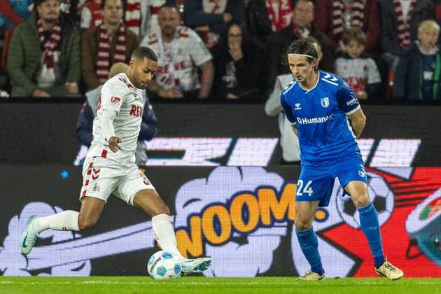 Soccer 2 Bundesliga 5 Matchday 1 FC Köln 1 FC Magdeburg on 14 09 2024 at RheinEnergieStadion in Cologne Linton Maina Köln , left Jean Hugonet Magdeburg , right DFB regulations prohibit any use of photographs as image sequences and or quasi video xJRx