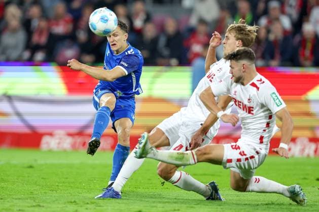14 09 2024, 2 Fußball Bundesliga, 1 FC Köln 1 FC Magdeburg, RheinEnergieSTADION, Saison 2024 2025 Martijn Kaars 1 FC Magdeburg 9 is blocked by Timo Hübers 1 FC Köln 4 and Jan Thielmann 1 FC Köln 29 DFB regulations prohibit any use of photographs as image sequences and or quasi video Nordrhein Westfalen Germany