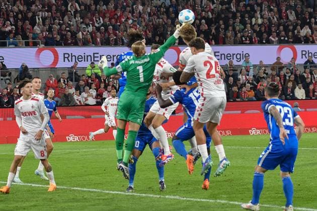 Penalty area scene Dominik Reimann Magdeburg 1 parries goal chance of Koeln 14 09 2024 Soccer 1 FC Koeln vs 1 FC Magdeburg, Rheinenergiestadion, Koeln, DFB DFL REGULATIONS PROHIBIT ANY USE OF PHOTOGRAPHS AS IMAGE SEQUENCES AND OR QUASI VIDEO NRW Germany Copyright: xpepphotox xSaschaxWeizx pep00321, pep_20240914_hm