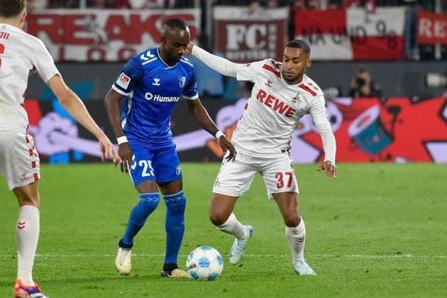 from left in duel Silas Gnaka Magdeburg 25 Linton Maina Koeln 37 14 09 2024 Soccer 1 FC Koeln vs 1 FC Magdeburg, Rheinenergiestadion, Koeln, DFB DFL REGULATIONS PROHIBIT ANY USE OF PHOTOGRAPHS AS IMAGE SEQUENCES AND OR QUASI VIDEO NRW Germany Copyright: xpepphotox xSaschaxWeizx pep00321, pep_20240914_hm