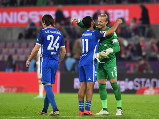14 09 2024, Cologne, Germany, RheinEnergieStadion, 1 FC Köln vs 1 FC Magdeburg 2 Bundesliga, Mohammed El Hankouri 1 FC Magdeburg and goalkeeper Dominik Reimann 1 FC Magdeburg cheer, cheer, cheer Photo Ralf Treese DFB DFL REGULATIONS PROHIBIT ANY USE OF PHOTOGRAPHS AS IMAGE SEQUENCES AND OR QUASI VIDEO Cologne RheinEnergieStadion North Rhine Westphalia Germany 521_KOEFCM20240914_090 Treese-521