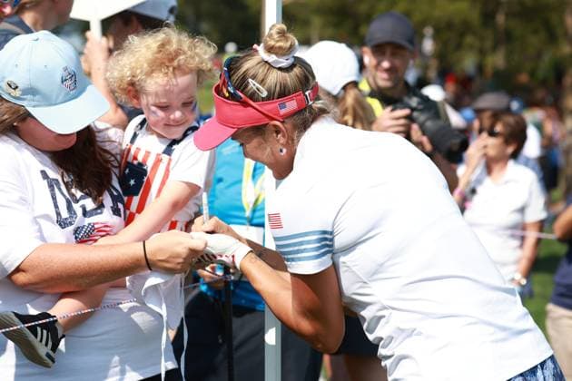 dGAINESVILLE, VA - SEPTEMBER 14: Team USA golfer Lexi Thompson signs autographs after she finishes on the 16th hole during Saturday Foursomes during the 2024 Solheim Cup on September 14, 2024 at Robert Trent Jones Golf Club at Gainesville, Virginia. (Photo by Brian Spurlock Icon Sportswire) GOLF: SEP 14 Solheim Cup EDITORIAL USE ONLY Icon240914103