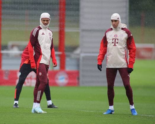Munich, Germany September 16, 2024 Football, Men, Season 2024 2025, FC Bayern Munich, Säbener Strasse, Training ground, Final training, Champions League Leroy Sane FC Bayern Munich left with Jamal Musiala FC Bayern Munich right standing in pouring rain