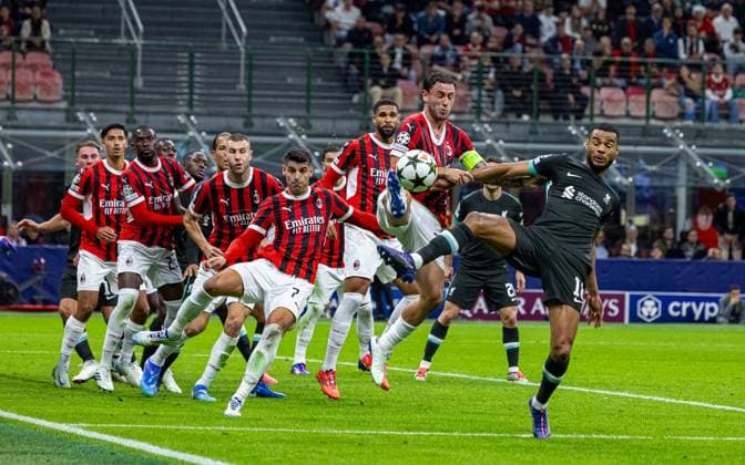 Football - UEFA Champions League - League Phase - AC Milan v Liverpool FC MILAN, ITALY - Tuesday, September 17, 2024: Liverpool s Cody Gakpo (R) is challenged by AC Milan s captain Davide Calabria during the UEFA Champions League game between AC Milan and Liverpool FC at the Stadio San Siro. ITALY Stadio San Siro LOMBARDY ITALY  Copyright: xDavidxRawcliffex P2024-09-17-AC_Milan_Liverpool-50