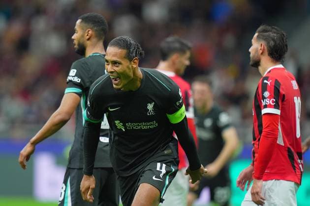 Liverpool s Van Dijk .celebrates after scoring 1-2 during the Uefa Champions League soccer match between Milan and Liverpool at the San Siro Stadium in Milan, north Italy -Tuesday , September 17 2024. - Soccer .  Copyright: xSpada LaPressex