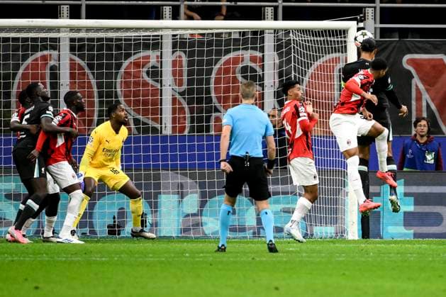 Virgil van Dijk of Liverpool FC (r) scores the goal of 1-2 during the UEFA Champions League 2024 205 football match between AC Milan and Liverpool FC at San Siro stadium in Milano (Italy), September 17, 2024. AndreaxStaccioli