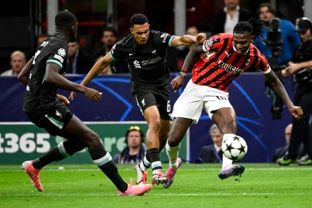 Trent Alexander-Arnold of Liverpool FC and Rafael Leao of AC Milan compete for the ball during the UEFA Champions League 2024 205 football match between AC Milan and Liverpool FC at San Siro stadium in Milano (Italy), September 17, 2024. AndreaxStaccioli