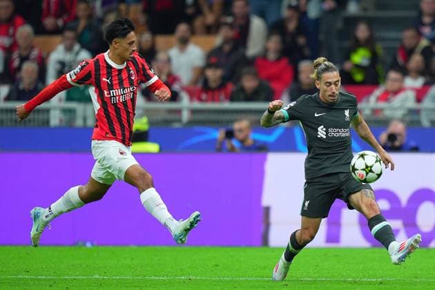 AC Milan s Tijjani Reijnders fight for the ball with Liverpool s Tsimikas during the Uefa Champions League soccer match between Milan and Liverpool at the San Siro Stadium in Milan, north Italy -Tuesday , September 17 2024. - Soccer .  Copyright: xSpada LaPressex