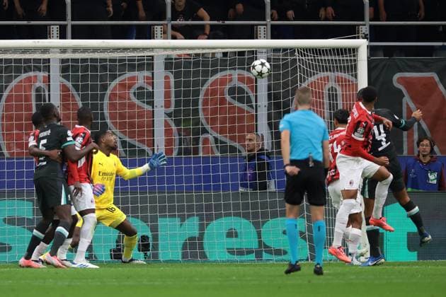 Milan, Italy, 17th September 2024. Virgil van Dijk of Liverpool FC scores to give the side a 2-1 lead during the UEFA Champions League match at Giuseppe Meazza, Milan. Picture credit should read: Jonathan Moscrop Sportimage EDITORIAL USE ONLY. No use with unauthorised audio, video, data, fixture lists, club league logos or live services. Online in-match use limited to 120 images, no video emulation. No use in betting, games or single club league player publications. SPI-3297-0021