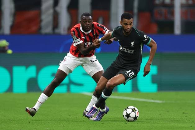 Milan, Italy, 17th September 2024. Youssouf Fofana of AC Milan tussles with Cody Gakpo of Liverpool FC during the UEFA Champions League match at Giuseppe Meazza, Milan. Picture credit should read: Jonathan Moscrop Sportimage EDITORIAL USE ONLY. No use with unauthorised audio, video, data, fixture lists, club league logos or live services. Online in-match use limited to 120 images, no video emulation. No use in betting, games or single club league player publications. SPI-3297-0030
