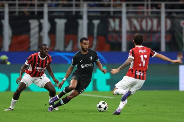 Milan, Italy, 17th September 2024. Cody Gakpo of Liverpool FC takes on Youssouf Fofana and Christian Pulisic of AC Milan during the UEFA Champions League match at Giuseppe Meazza, Milan. Picture credit should read: Jonathan Moscrop Sportimage EDITORIAL USE ONLY. No use with unauthorised audio, video, data, fixture lists, club league logos or live services. Online in-match use limited to 120 images, no video emulation. No use in betting, games or single club league player publications. SPI-3297-0031