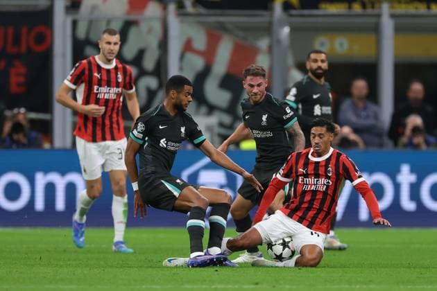 Milan, Italy, 17th September 2024. Cody Gakpo of Liverpool FC clashes iwth Tijjani Reijnders of AC Milan during the UEFA Champions League match at Giuseppe Meazza, Milan. Picture credit should read: Jonathan Moscrop Sportimage EDITORIAL USE ONLY. No use with unauthorised audio, video, data, fixture lists, club league logos or live services. Online in-match use limited to 120 images, no video emulation. No use in betting, games or single club league player publications. SPI-3297-0032