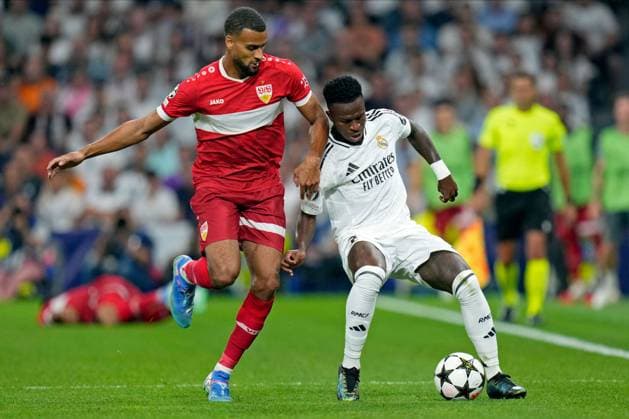 Jamie Leweling of VfB Stuttgart and Vinicius Junior of Real Madrid CF Real Madrid v VFB Stuttgart, UEFA Champios League match, date 1. Football, Santiago Bernabeu Stadium, Madrid, Spain - 17 Sep 2024 Editorial use only  Copyright: xPressinphoto Shutterstockx 14725330p