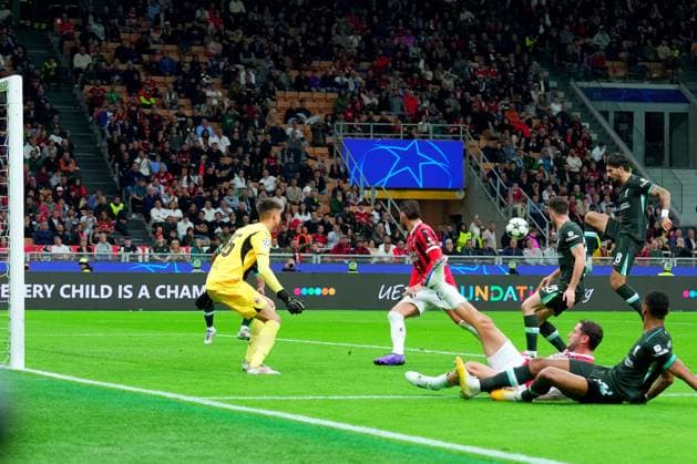 LiverpoolDominik Szobosziai scores the goal 3-1 during the Uefa Champions League soccer match between Milan and Liverpool at the San Siro Stadium in Milan, north Italy -Tuesday , September 17 2024. - Soccer .  Copyright: xSpada LaPressex