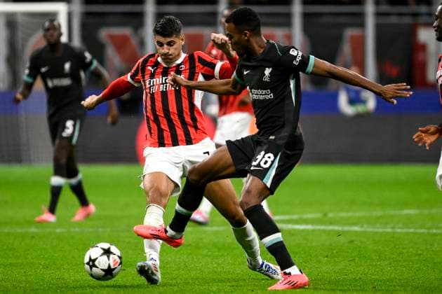 Alvaro Morata of AC Milan and Ryan Gravenberch of Liverpool FC compete for the ball during the UEFA Champions League 2024 205 football match between AC Milan and Liverpool FC at San Siro stadium in Milano (Italy), September 17, 2024. AndreaxStaccioli